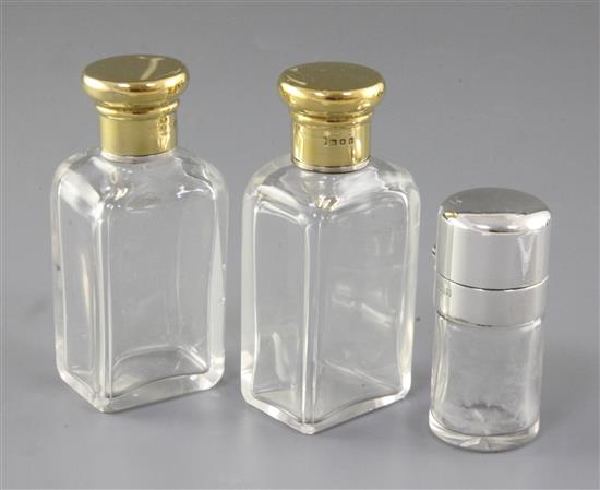 An Edwardian silver mounted glass scent bottle & a pair of scent bottles.